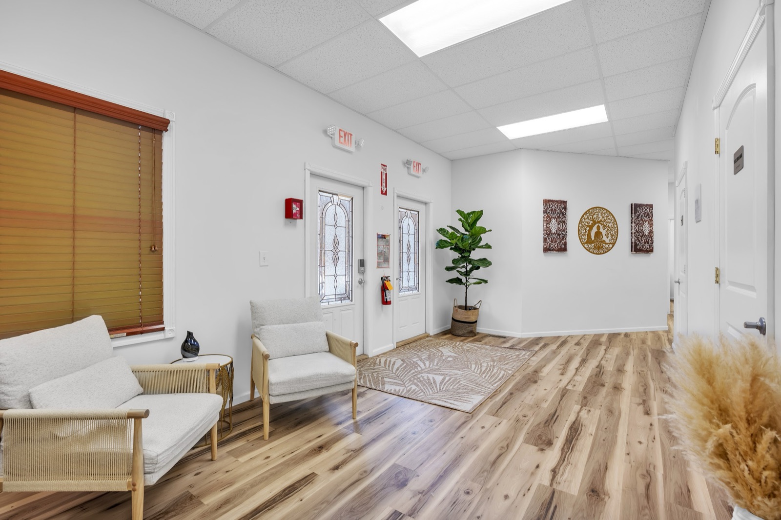 Entry hall with a seating area beside the front doors