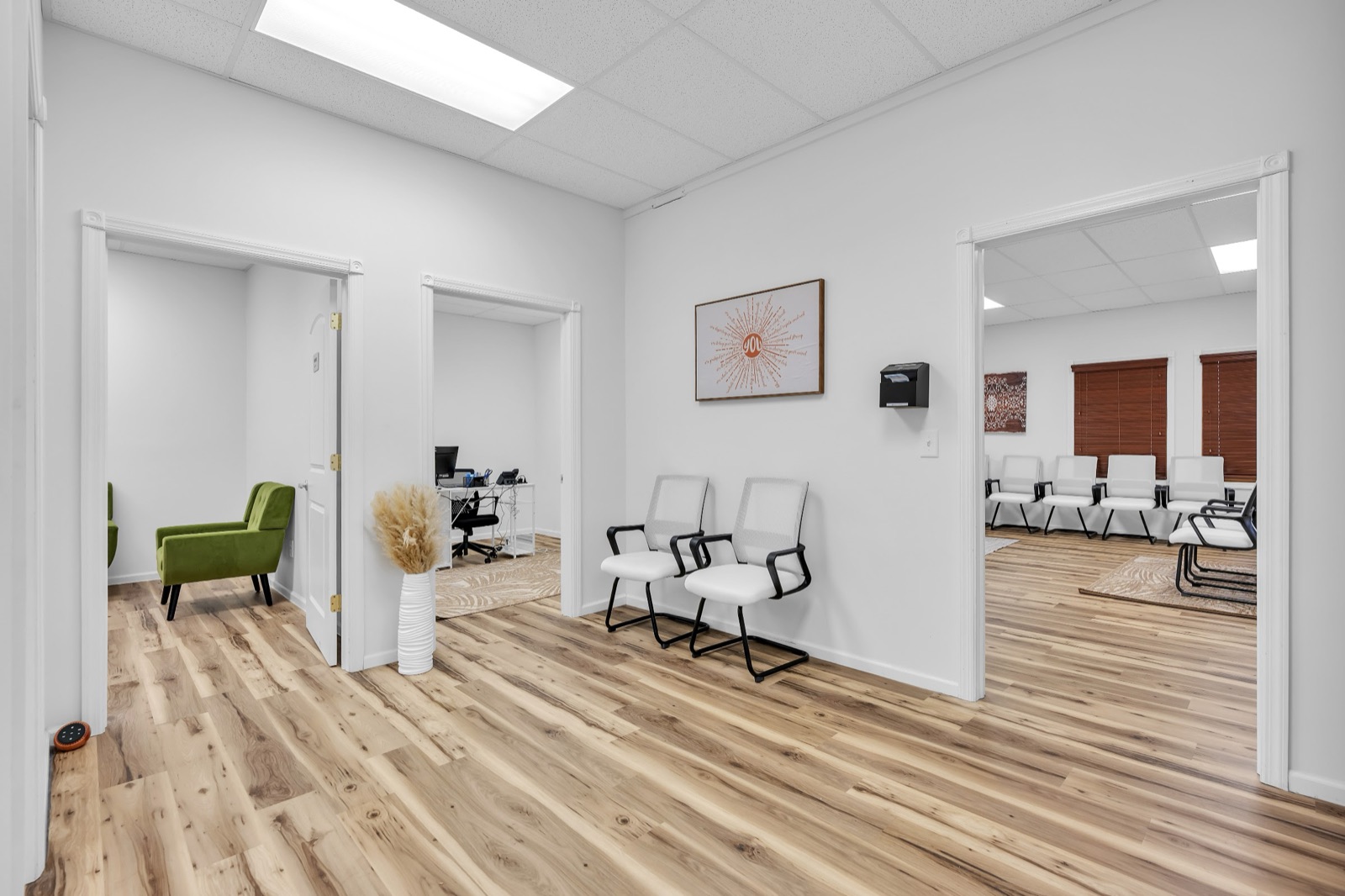 Hallway with offices on one side and the group room on the other