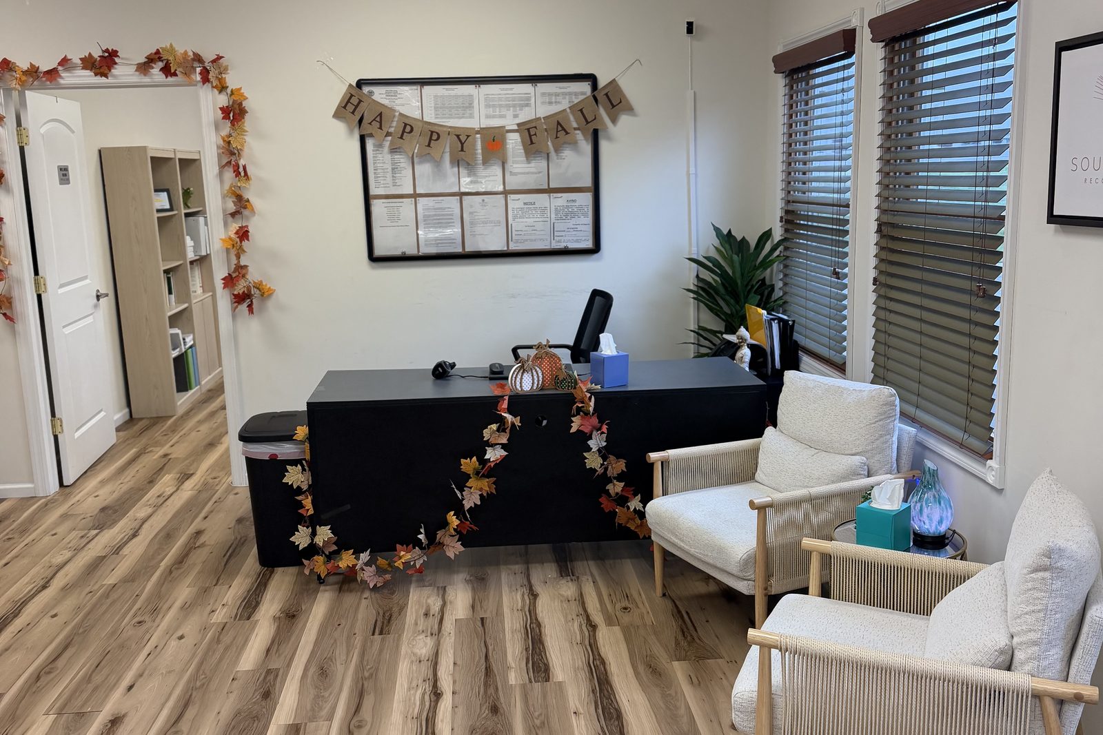 Staff office with a desk and two armchairs for visitors